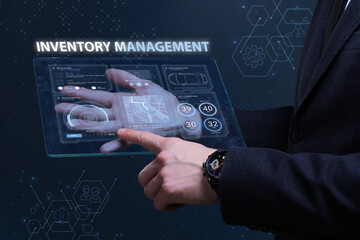 Business, Technology, Internet and network concept. Financial Graph. Stock Market chart. Young businessman working on a virtual screen of the future and sees the inscription: Inventory management