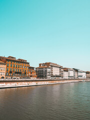 Obraz premium Street view of promenade next to Arno River in Pisa in Italy