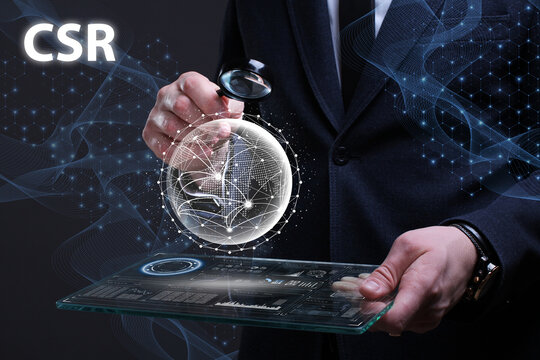 Business, Technology, Internet and network concept. Financial Graph. Stock Market chart. Young businessman working on a virtual screen of the future and sees the inscription: CSR