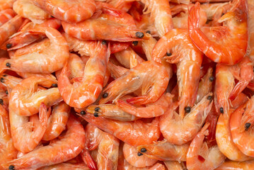 Shrimps background texture. A lot of shrimps. Cooked shrimps.