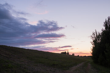 Naklejka na ściany i meble Sunset sky, skyline, field road. Wallpaper, background. 