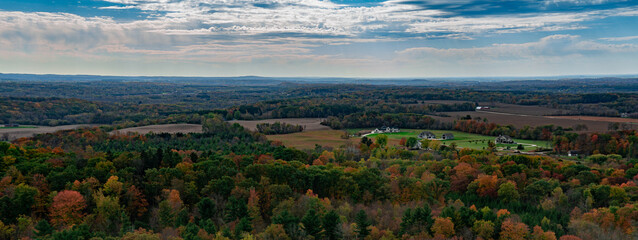 rolling hills and farmfields in autumn