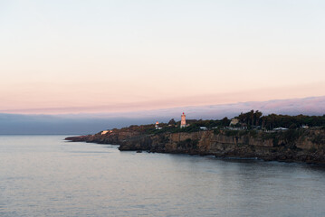 Farol da Guia on Cascais coastline at sunset