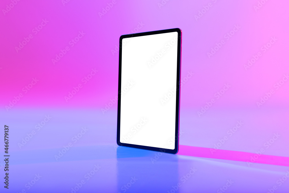 Poster Tablet pc with space for app or website on empty white screen in neon light. Mockup