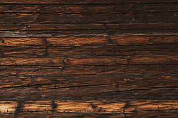Closeup picture of old rustic wooden planks eaten by caries