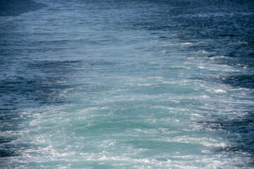 Seascape of water behind a ferry ship in fjord in North Iceland