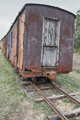 Fototapeta na wymiar Old freight wagon on railway tracks
