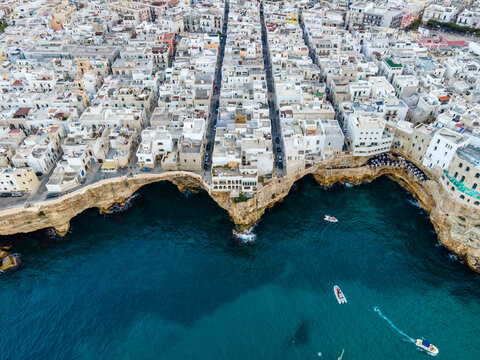 Aerial view of Polignano, a small town in white architecture along the Adriatic Sea near Bari, Puglia, Italy.