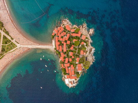 Aerial view of Sveti Stefan Peninsula, a small town in Mediterranean Sea in Balkans peninsula near Budva, Montenegro.