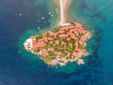 Aerial view of Sveti Stefan Peninsula, a small town in Mediterranean Sea in Balkans peninsula near Budva, Montenegro.