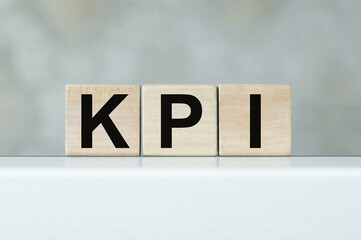 KPI - wooden blocks with letters, key performance indicator KPI concept, cubes on the table