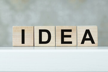 wood cubes with idea text on a light table