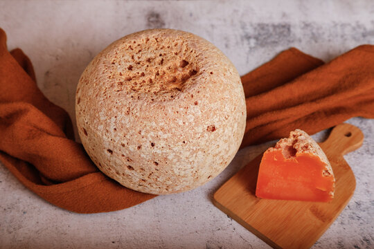 A wedge of gourmet Mimolette french cheese 
