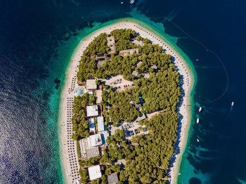 Aerial view of Otocic Smokvica island, a small desert and paradise island near Primosten shoreline, Sibenik province, Croatia.