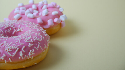 Food. Dessert. Dessert colorful snack. Delicious donut with sprinkles. Bakery cake. Sweet food dessert donuts. Close-up of donuts (Berlin pancakes)