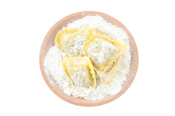 Board with raw ravioli isolated on white background