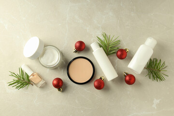 Composition with winter cosmetic products on light textured background