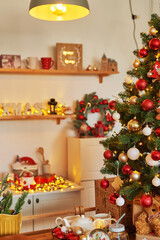 Christmas kitchen. Red and gold decor christmas tree background. New Year celebration. Merry Christmas and Happy New Year.
