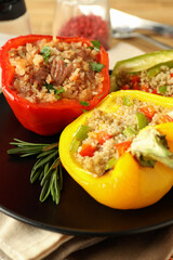 Concept of tasty food with ​stuffed pepper on wooden background