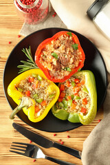 Concept of tasty food with ​stuffed pepper on wooden background