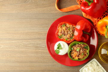 Concept of tasty food with ​stuffed pepper on wooden background