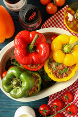Concept of tasty food with ​stuffed pepper on wooden background