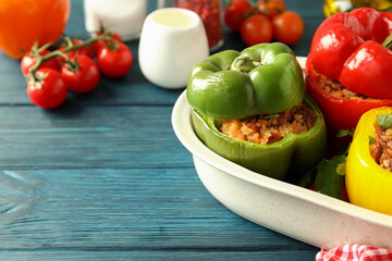 Concept of tasty food with ​stuffed pepper on wooden background