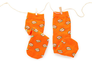 Twine with socks with burgers isolated on white background