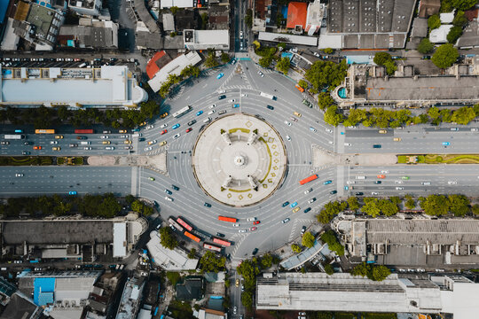 Aerial view of vehicles driving at Democracy Monument city roundabout in Bangkok, Thailand.