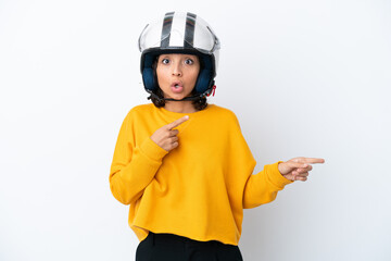 Woman with a motorcycle helmet surprised and pointing side