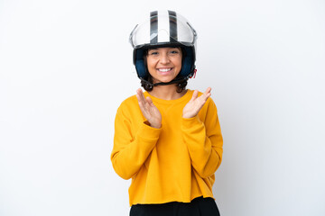 Woman with a motorcycle helmet applauding after presentation in a conference