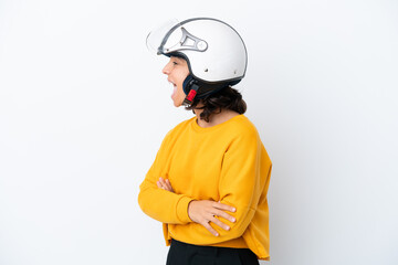 Woman with a motorcycle helmet laughing in lateral position