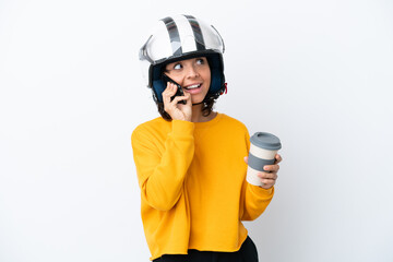 Woman with a motorcycle helmet holding coffee to take away and a mobile