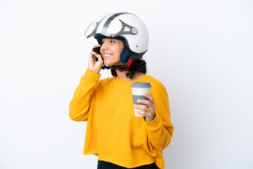 Woman with a motorcycle helmet holding coffee to take away and a mobile