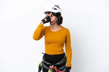 Young woman rock-climber woman isolated on white background covering eyes by hands and smiling