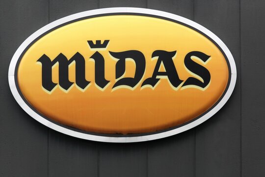 Orleans, France - March 19, 2017: Midas logo on a wall. Midas is an American chain of automotive service centers headquartered in Itasca, Illinois 