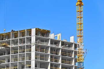 Crane and highrise construction site