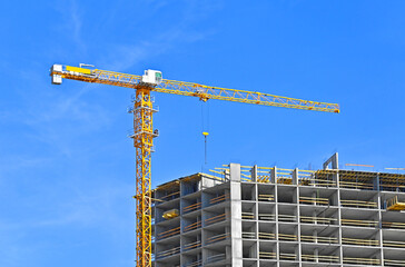 Crane and highrise construction site