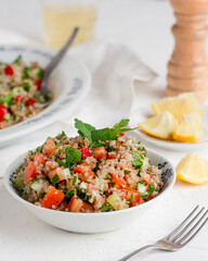 taboule: arabic salad with wheat, cucumber, tomato, onion and parsley