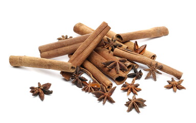 Cinnamon sticks and star anise pile isolated on white 