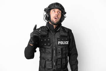 Fototapeta premium SWAT caucasian man isolated on white background thinking an idea pointing the finger up