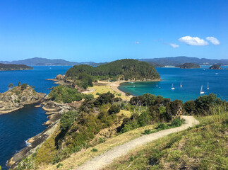 View from the track at top of Roberton Island, boats in the bay, blue skies, summer, Bay of Islands, NZ