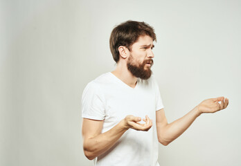 emotional man in a white t-shirt irritated facial expression close-up