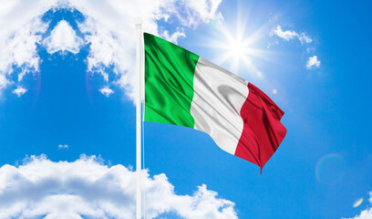 Italy flag waving against a blue sky with white clouds. italy flag.