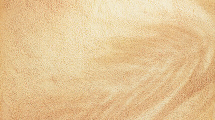 Sand background with copy space for text. Sand texture closeup with palm shadow. Horizontal...