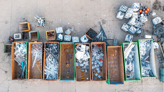 Containers from a height with different types of metal, Sorting for remelting metal products