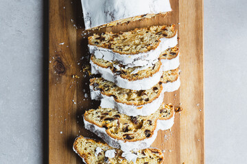 Directly above shot of Marzipan Stollen cake with icing sugar, sliced