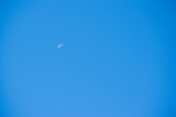 Moon in Blue Sky
