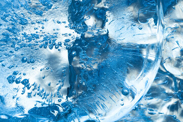 Macro view ice pattern textured background. Blue crystal transparent ice wallpaper. Winter Christmas frosted arctic scene