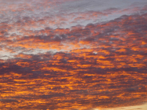 Magnificent morning sky just after sunrise with orange colored clouds 